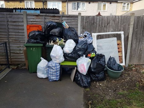 Construction site with builders clearing waste in Wandsworth