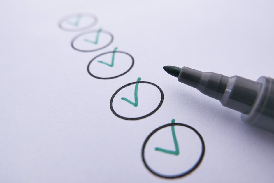 A close-up image of a white sheet of paper featuring six hand-drawn circles outlined in black ink, each containing a green check mark. The circles are arranged vertically, with the bottom circle being